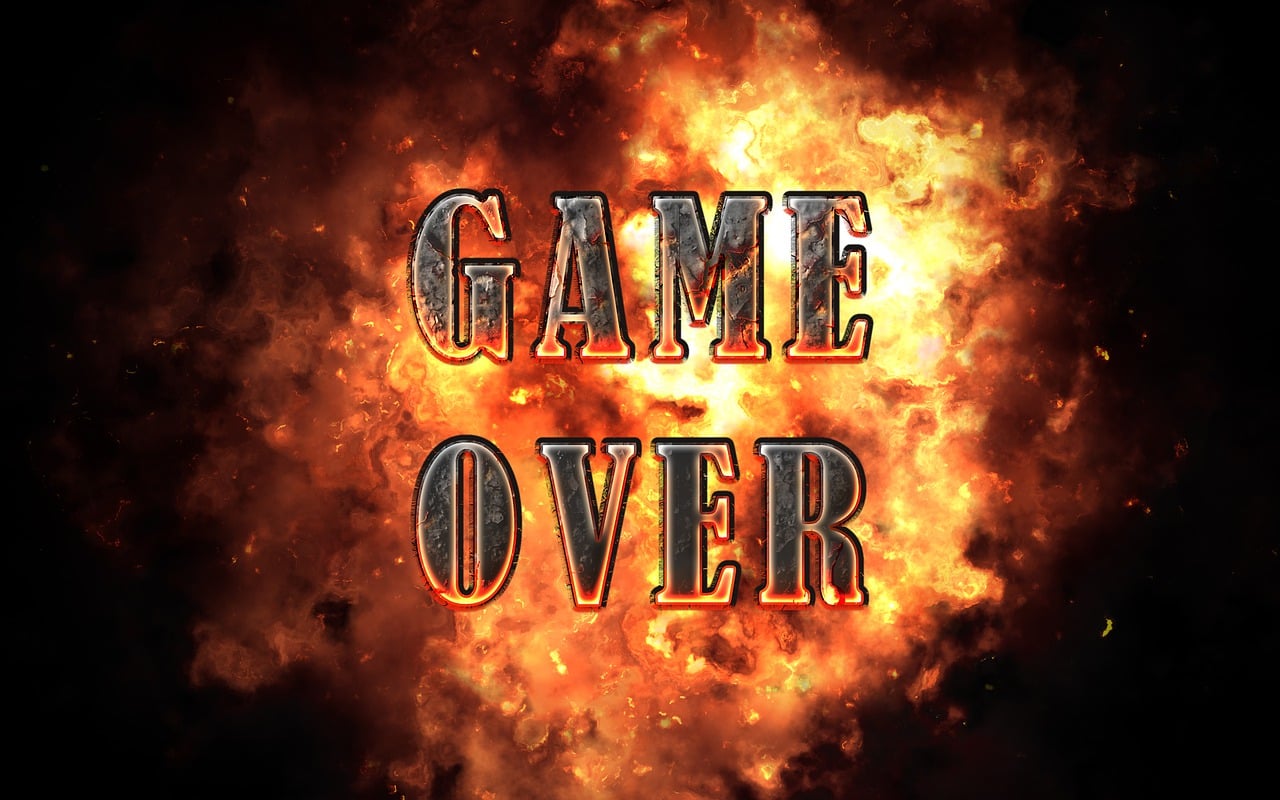 A fiery explosion with metallic 'Game Over' text