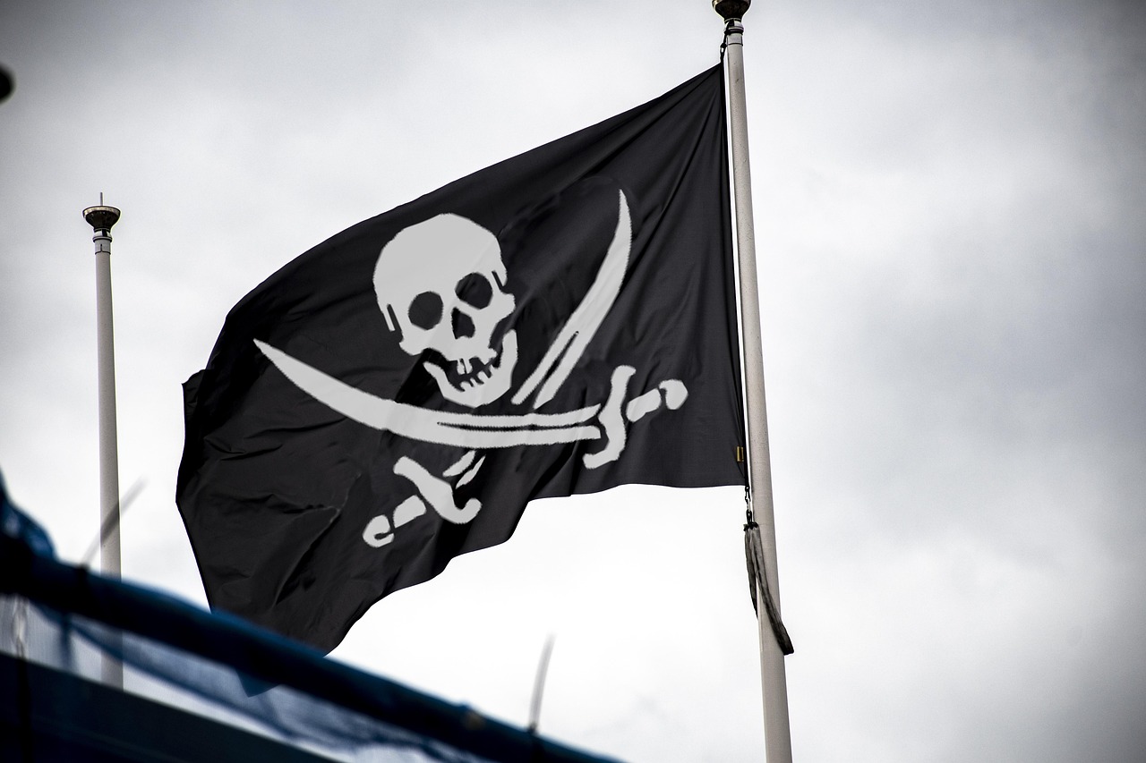 A black pirate flag with a white skull-and-crossbones emblem